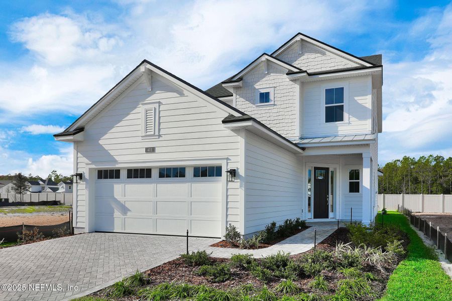 Front exterior of a new home in Seabrook Village at Seabrook, Ponte Vedra, FL, highlighting curb appeal (Image 19).
