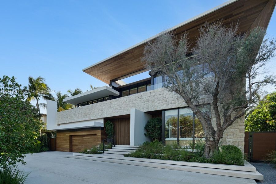 Front exterior of a new home in , Golden Beach, FL, highlighting curb appeal (Image 10).