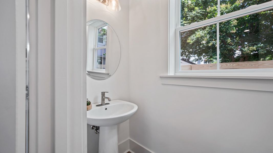 Convenient powder room in the Sullivan home plan with modern fixtures and elegant details.