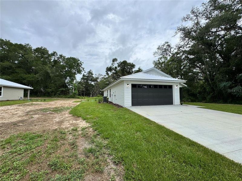 Front exterior of a new home in , Trenton, FL, highlighting curb appeal (Image 2). Front exterior of a new home in , Trenton, FL, highlighting curb appeal (Image 2).