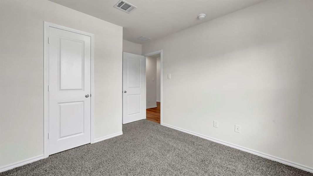 Neutral gray carpeting paired with white walls
