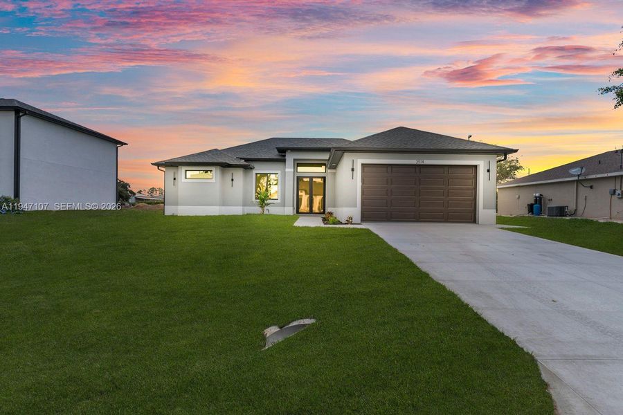 Front exterior of a new home in , Lehigh Acres, FL, highlighting curb appeal (Image 19).
