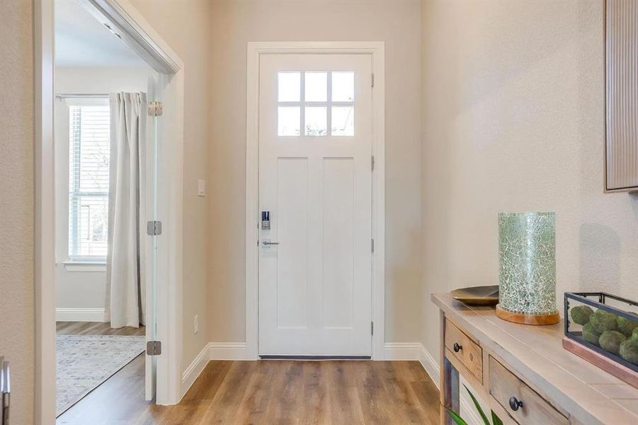 Entryway featuring a healthy amount of sunlight and light wood-type flooring