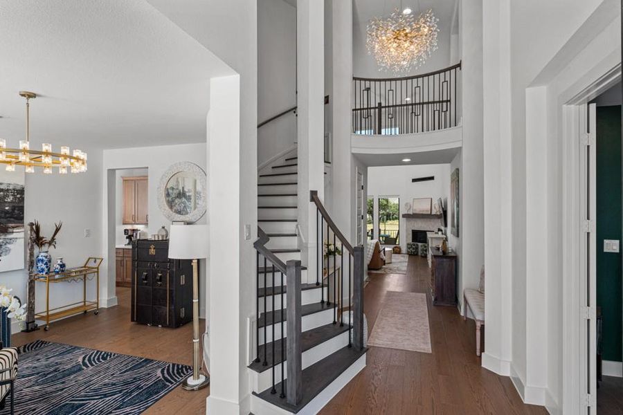 A grand entry with sweeping staircase and an opulent chandelier creates an immediate impression of luxury. A grand entry with sweeping staircase and an opulent chandelier creates an immediate impression of luxury.