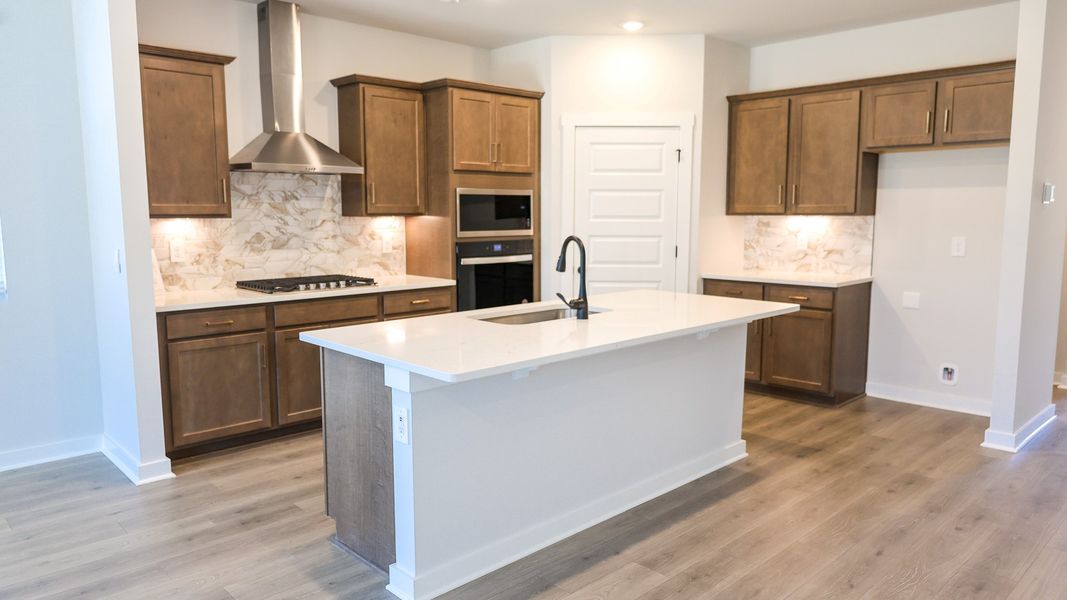 Representative furnished interior of a home built from the EMBRY by D.R. Horton in Harvest Point, Spring Hill (Image 9).