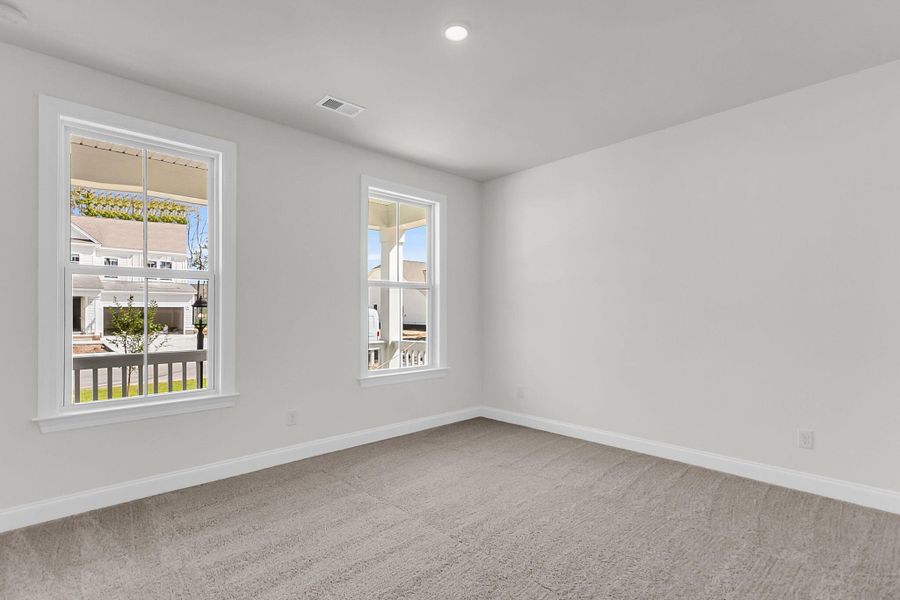 Spacious, unfurnished interior of a new home in Tidewater at Lakes of Cane Bay, Summerville (Image 25).