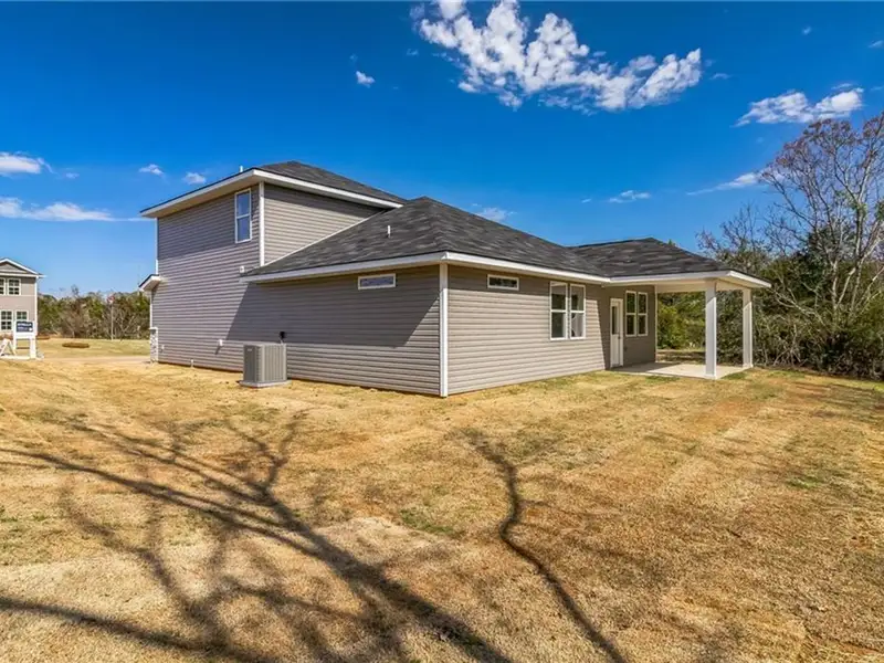Exterior details and patio area of a home in Ivy Glen, Perry (Image 2).