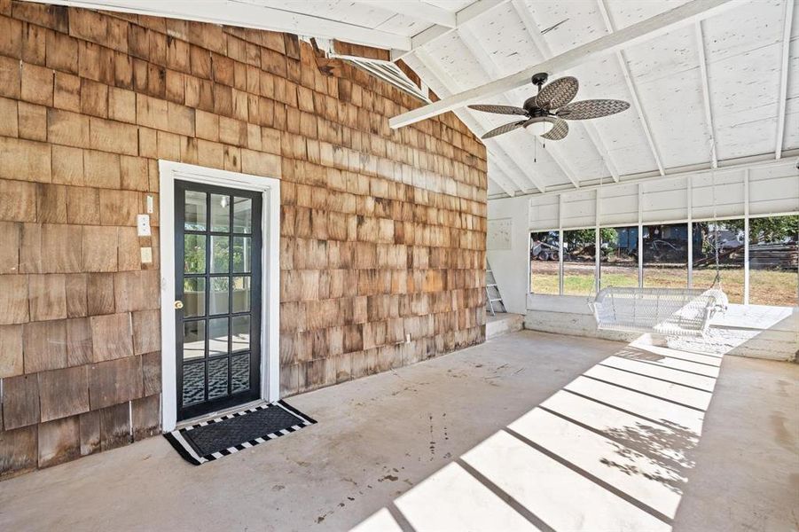 Entrance to Screened Porch featuring ceiling fan and a patio area