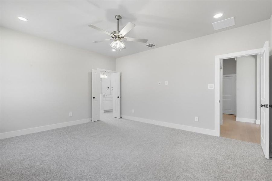 Unfurnished bedroom with recessed lighting, light carpet, and a ceiling fan Unfurnished bedroom with recessed lighting, light carpet, and a ceiling fan