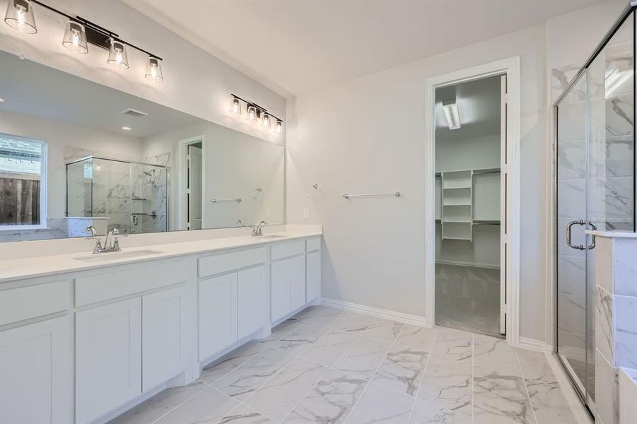 Bathroom with vanity and an enclosed shower