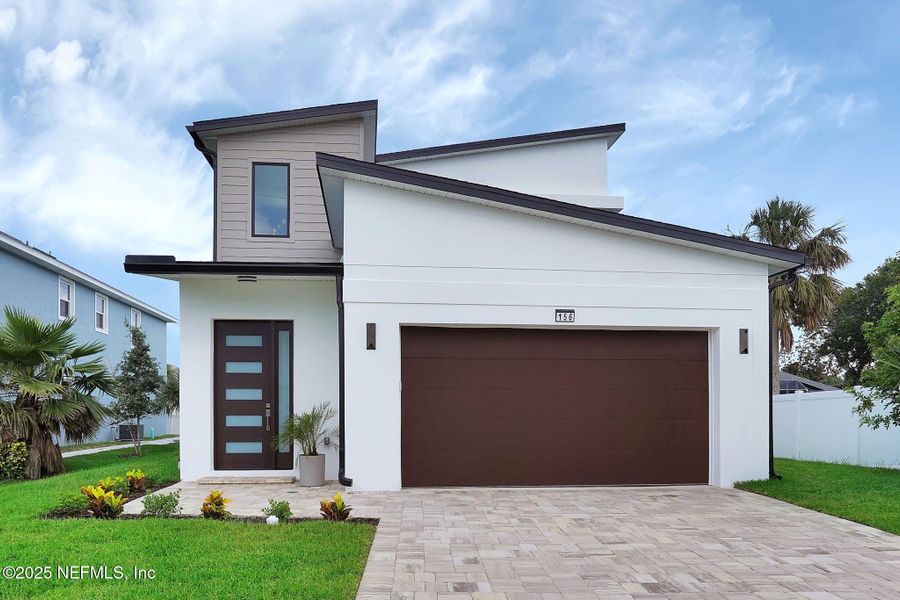 Front exterior of a new home in , Ormond Beach, FL, highlighting curb appeal (Image 2).