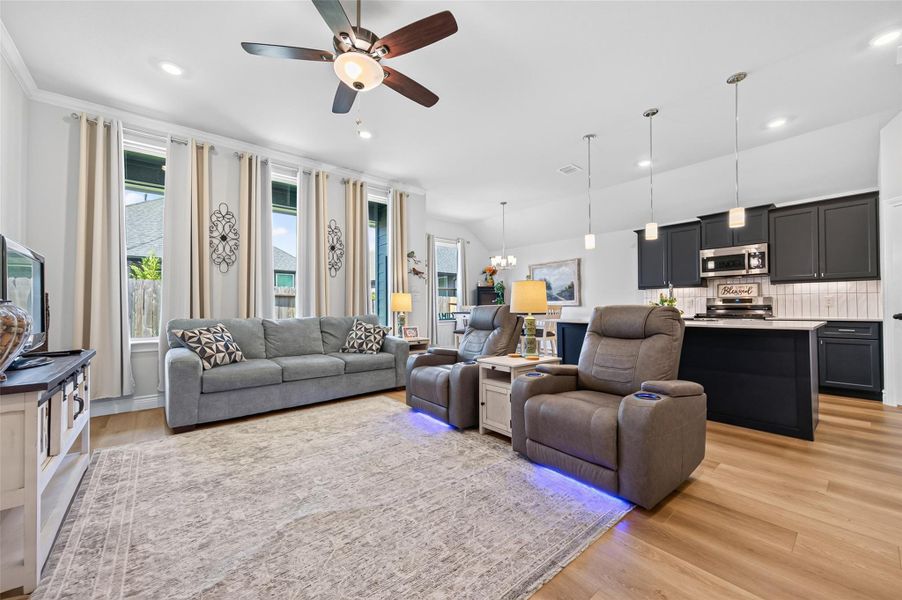 This beautifully designed, expansive living area features a sophisticated open-concept floor plan that seamlessly connects the space, providing an ideal setting for both intimate family gatherings and large-scale entertaining. The generous square footage offers remarkable flexibility, allowing for a variety of versatile furniture arrangements to suit your specific lifestyle needs, while large windows bathe the room in abundant natural light, highlighting the inviting and airy atmosphere throughout. This beautifully designed, expansive living area features a sophisticated open-concept floor plan that seamlessly connects the space, providing an ideal setting for both intimate family gatherings and large-scale entertaining. The generous square footage offers remarkable flexibility, allowing for a variety of versatile furniture arrangements to suit your specific lifestyle needs, while large windows bathe the room in abundant natural light, highlighting the inviting and airy atmosphere throughout.