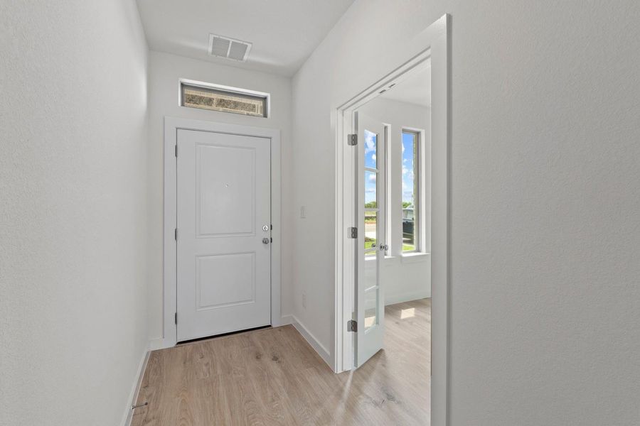 Entry in the Pearl home plan by Trophy Signature Homes – REPRESENTATIVE PHOTO Entry in the Pearl home plan by Trophy Signature Homes – REPRESENTATIVE PHOTO