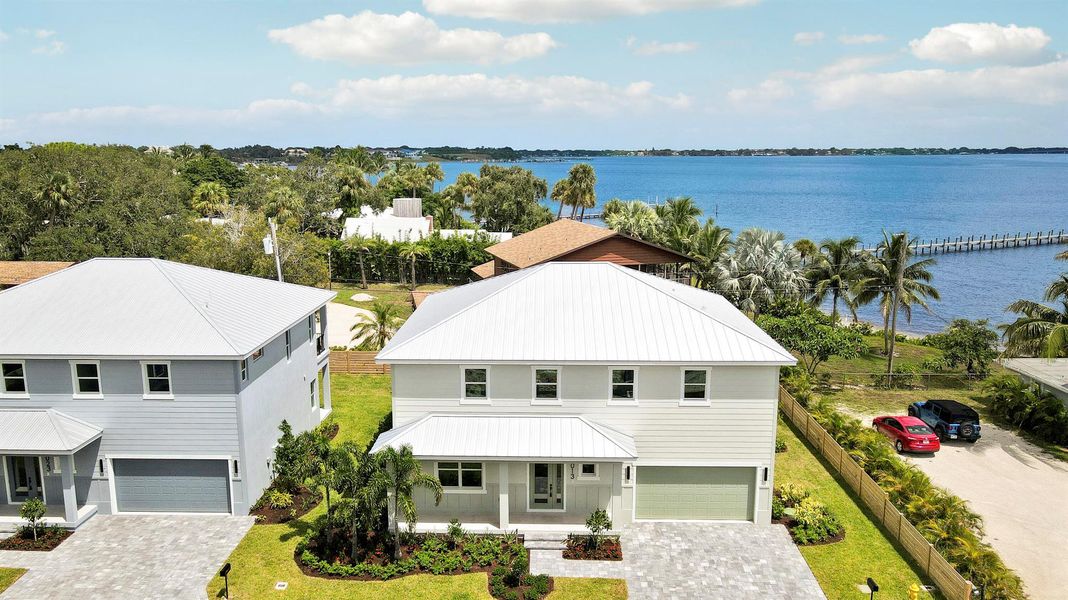 Front exterior of a new home in , Jensen Beach, FL, highlighting curb appeal (Image 26).