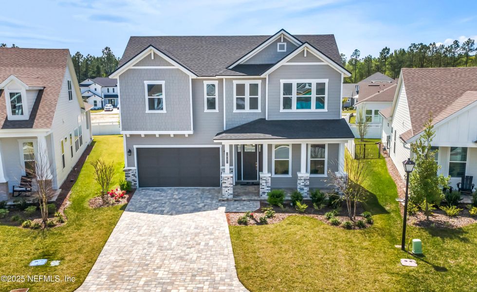 Front exterior of a new home in Courtney Chase, St. Augustine, FL, highlighting curb appeal (Image 2). Front exterior of a new home in Courtney Chase, St. Augustine, FL, highlighting curb appeal (Image 2).
