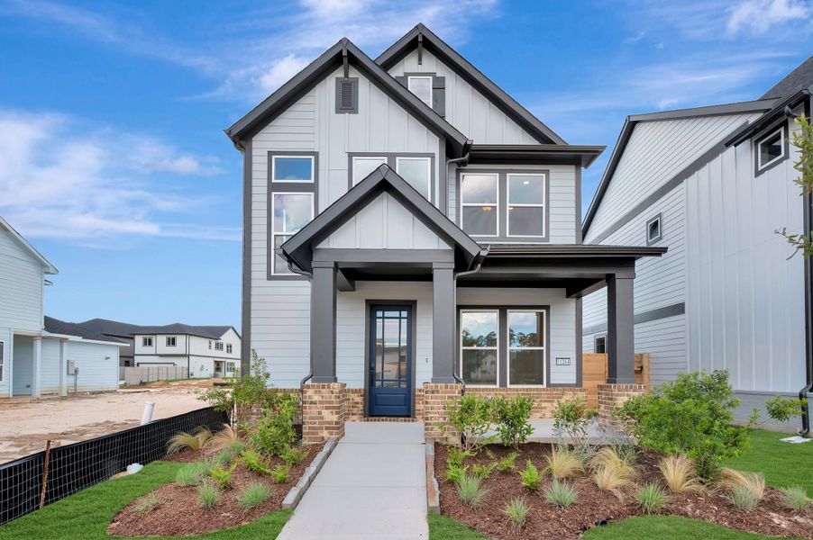 Front exterior of a new home in Two Step Farm - Cottages Row Collection, Montgomery, TX, highlighting curb appeal (Image 21).