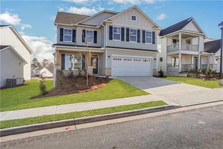Front exterior of a new home in Twin Lakes, Hoschton, GA, highlighting curb appeal (Image 24).