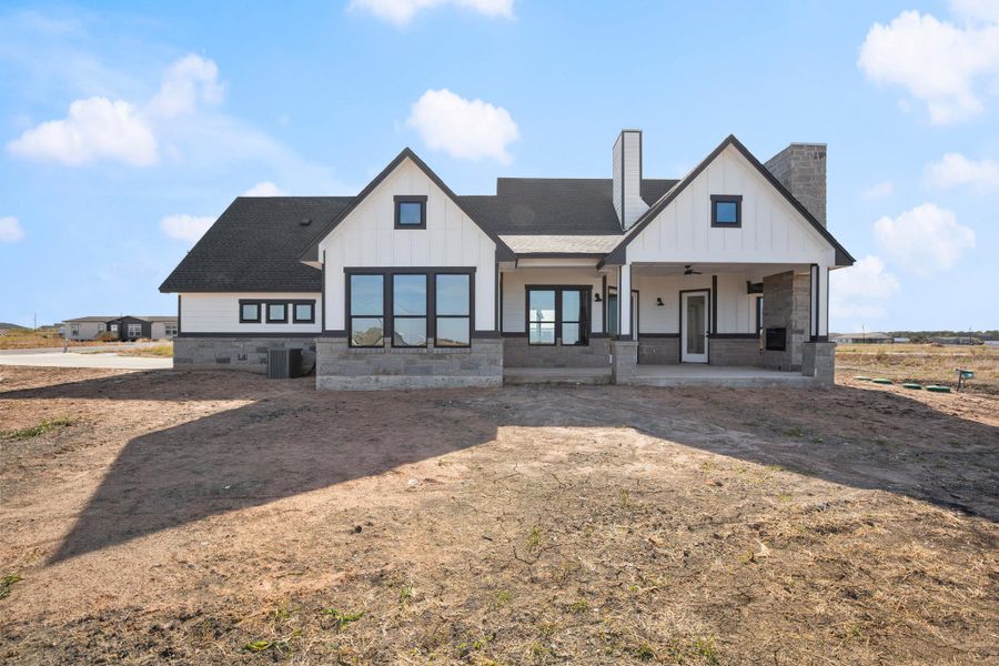 A new construction home with modern farmhouse charm, featuring clean lines and a welcoming covered entry. A new construction home with modern farmhouse charm, featuring clean lines and a welcoming covered entry.