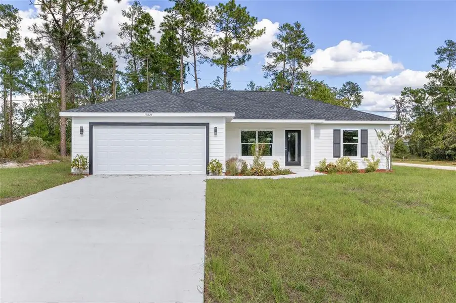 Front exterior of a new home in , Ocala, FL, highlighting curb appeal (Image 1).