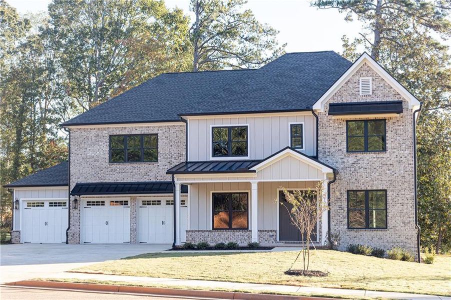 Front exterior of a new home in , Decatur, GA, highlighting curb appeal (Image 1).