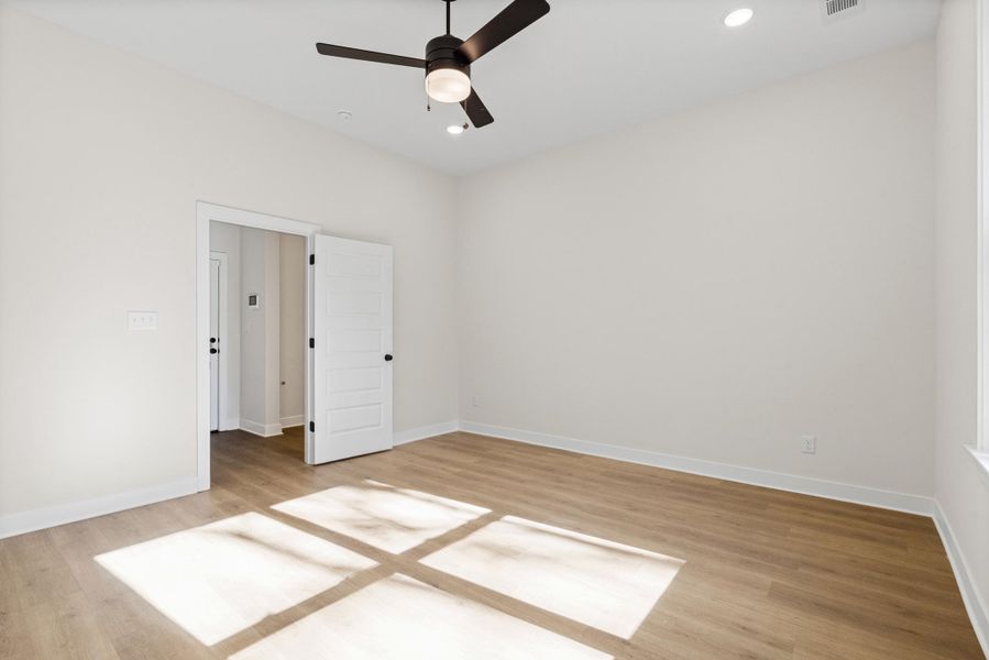 Unfurnished bedroom featuring light wood-type flooring, recessed lighting, and a ceiling fan Unfurnished bedroom featuring light wood-type flooring, recessed lighting, and a ceiling fan