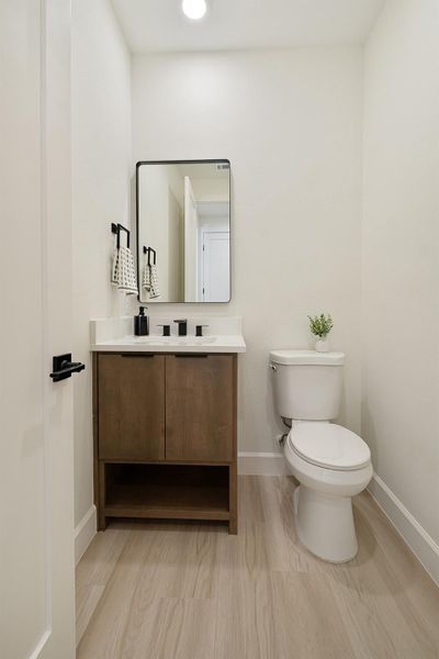 Bathroom featuring vanity and light wood-style flooring