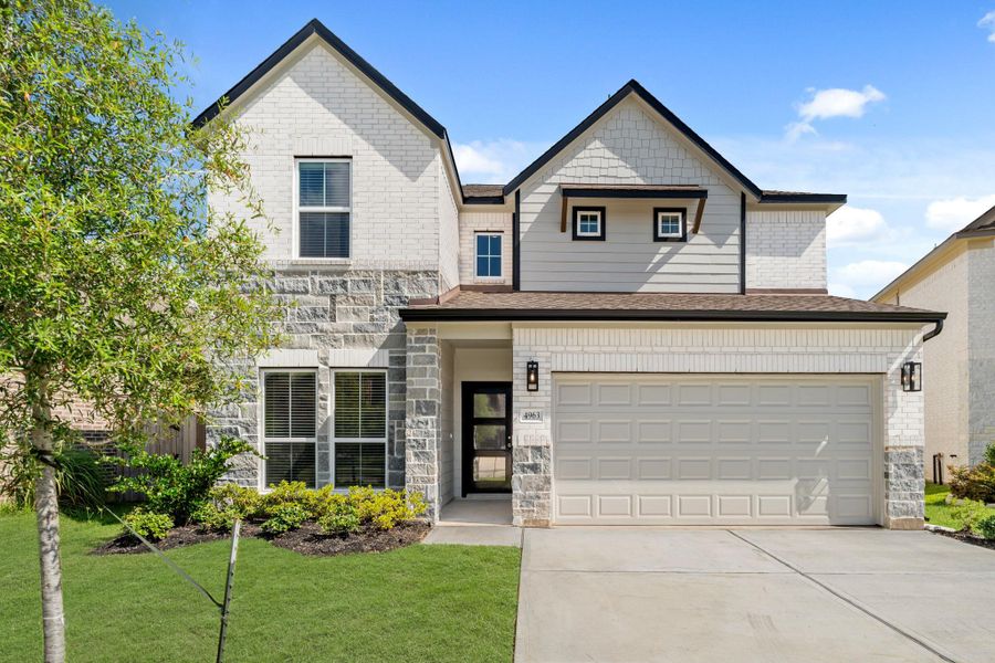 Front exterior of a new home in Grand Oaks – The Cove, Houston, TX, highlighting curb appeal (Image 15). Front exterior of a new home in Grand Oaks – The Cove, Houston, TX, highlighting curb appeal (Image 15).