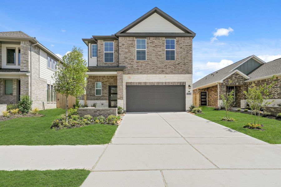 Front exterior of a home in the Creekland Village at Bridgeland community, located in Cypress, TX (Image 10).
