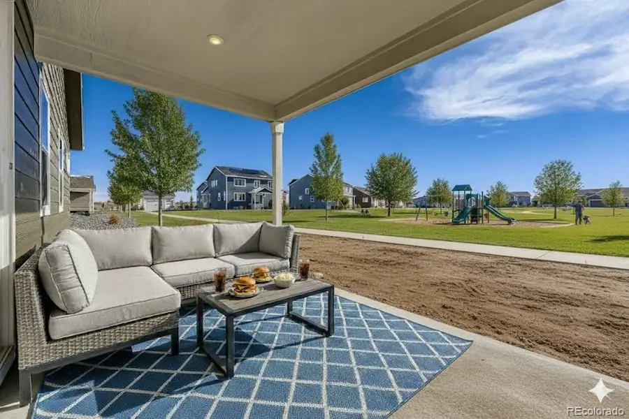 Newport Covered Back Patio Backs to the Park - Virtually staged photo Newport Covered Back Patio Backs to the Park - Virtually staged photo