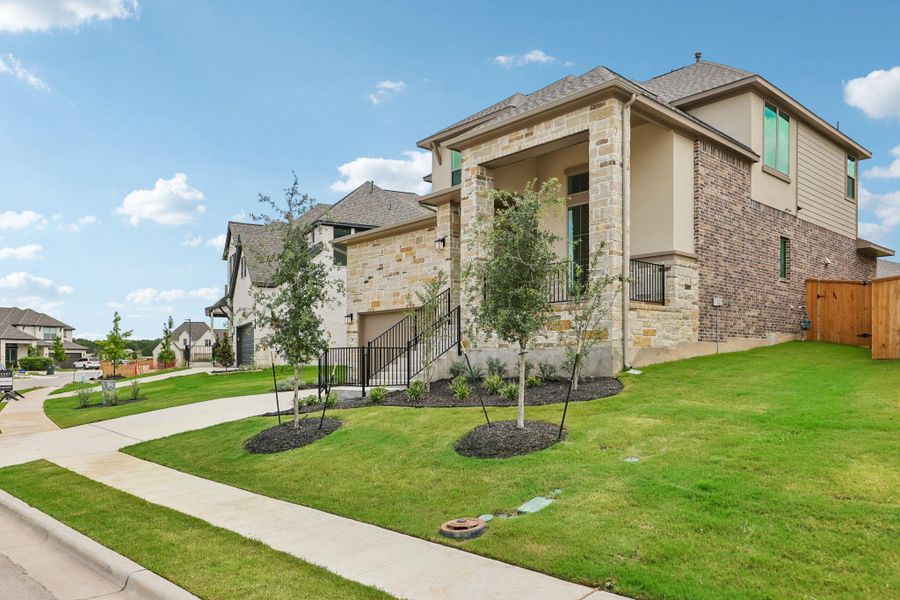 Front exterior of a new home in 6 Creeks, Kyle, TX, highlighting curb appeal (Image 2). Front exterior of a new home in 6 Creeks, Kyle, TX, highlighting curb appeal (Image 2).