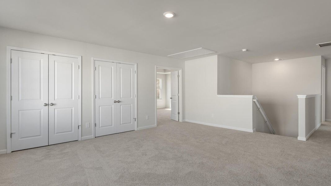 Spacious, unfurnished interior of a new home in The Haven at Indigo Preserve, Leland (Image 28).