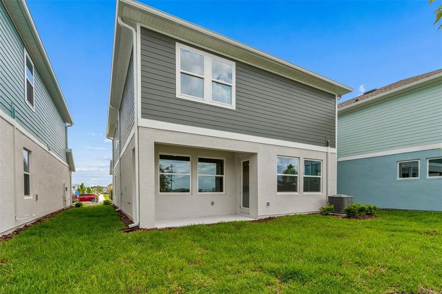 Exterior details and patio area of a home in Persimmon Place – Garden Series, Wesley Chapel (Image 4).