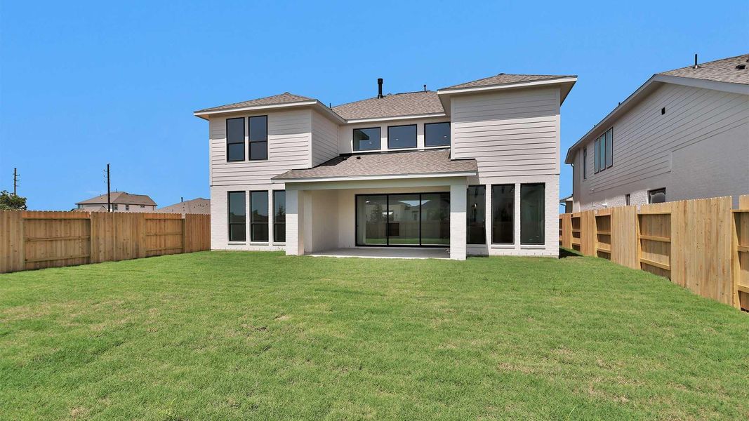 Exterior details and patio area of a home in Lakes of Cane Island, Katy (Image 3).