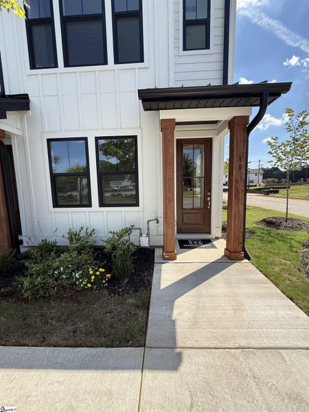 Exterior details and patio area of a home in Renaissance Place, Greenville (Image 3).