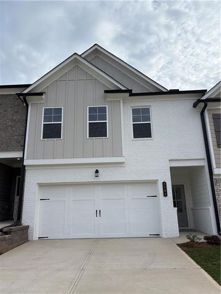 Front exterior of a new home in , Oakwood, GA, highlighting curb appeal (Image 1).