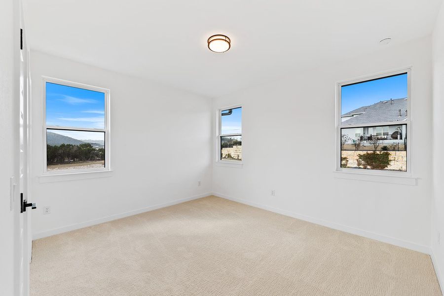 Secondary Bedroom ample windows providing natural lighting. Secondary Bedroom ample windows providing natural lighting.