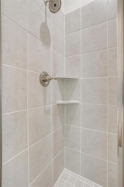 Bathroom featuring tiled shower