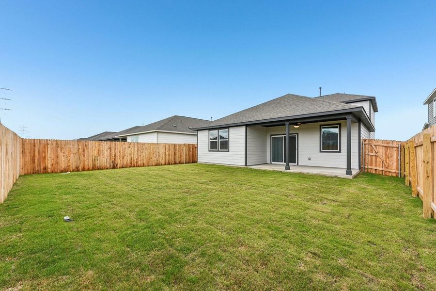 Exterior details and patio area of a home in Stallion Run, Buda (Image 22).
