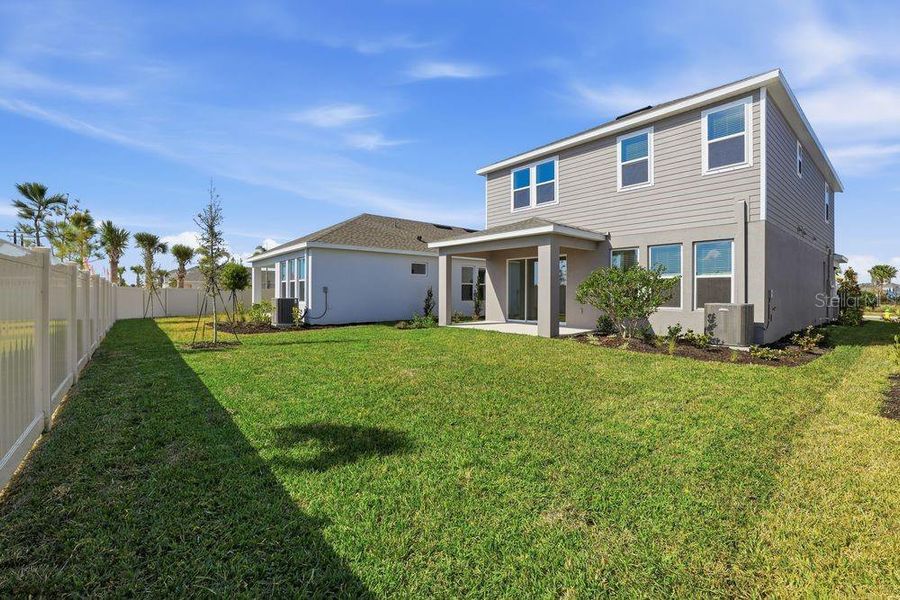 Exterior details and patio area of a home in Indigo Creek, Apollo Beach (Image 29).