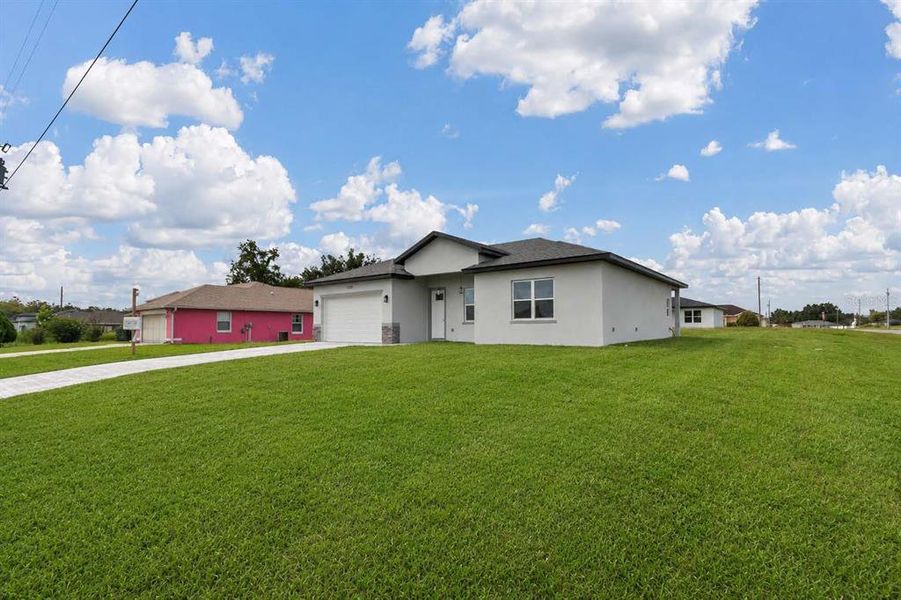 Front exterior of a new home in , Ocala, FL, highlighting curb appeal (Image 22). Front exterior of a new home in , Ocala, FL, highlighting curb appeal (Image 22).
