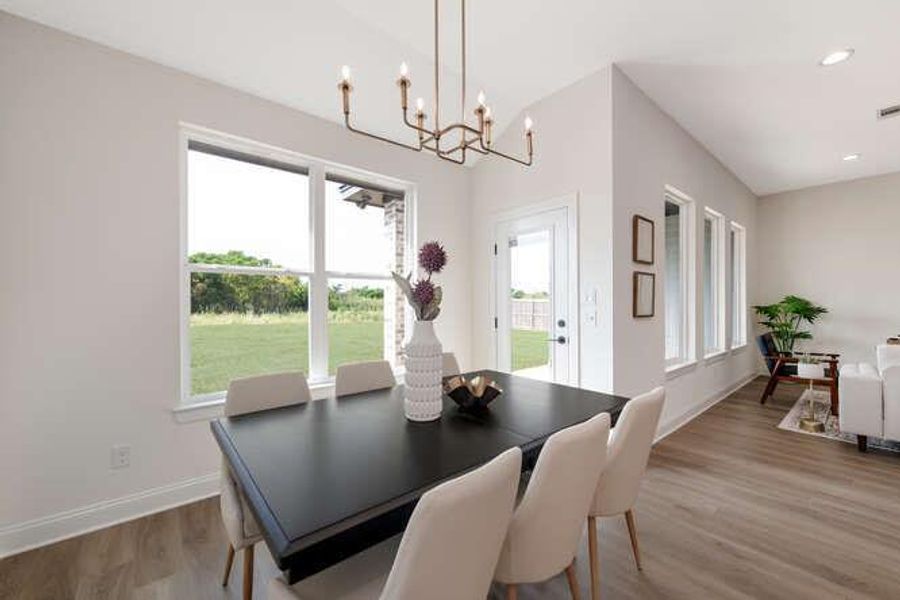 Dining area with light wood-style flooring, healthy amount of natural light, and recessed lighting Dining area with light wood-style flooring, healthy amount of natural light, and recessed lighting