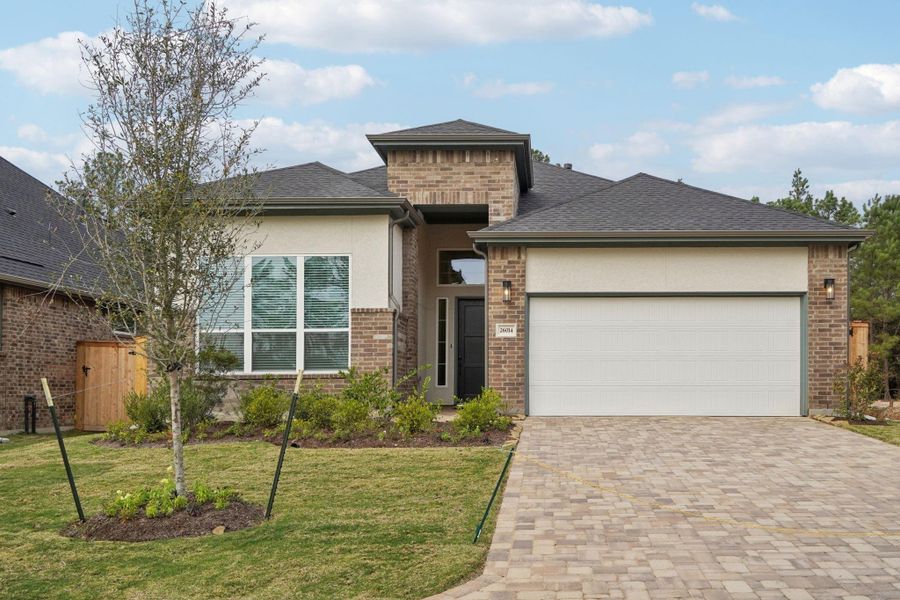 Front exterior of a new home in Kresston 50's, Montgomery, TX, highlighting curb appeal (Image 2). Front exterior of a new home in Kresston 50's, Montgomery, TX, highlighting curb appeal (Image 2).