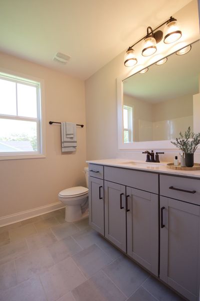 Representative furnished interior of a home built from the Beaufort by Stevens Fine Homes in Parkwood Estates, Leland (Image 17).