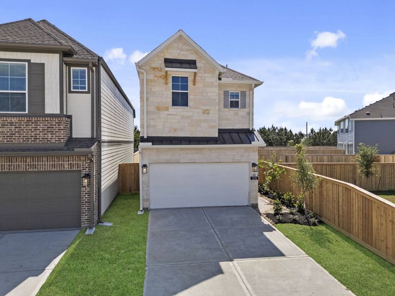 Front exterior of a new home in Bridgeland, Cypress, TX, highlighting curb appeal (Image 24).
