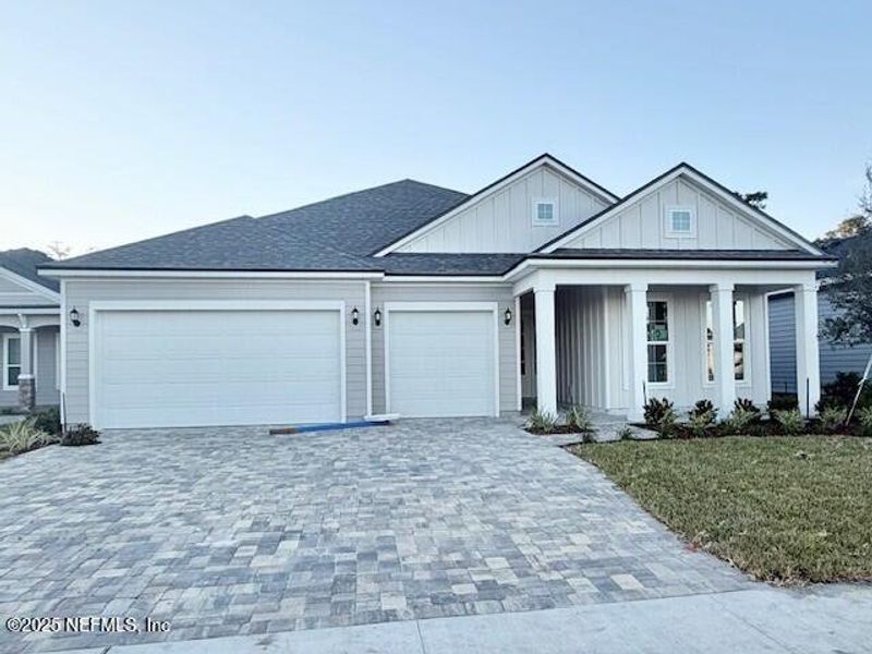 Front exterior of a new home in Silver Landing at SilverLeaf, St. Augustine, FL, highlighting curb appeal (Image 1).