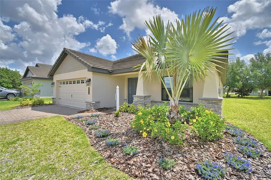Front exterior of a new home in Lake Juliana Estates, Auburndale, FL, highlighting curb appeal (Image 25).
