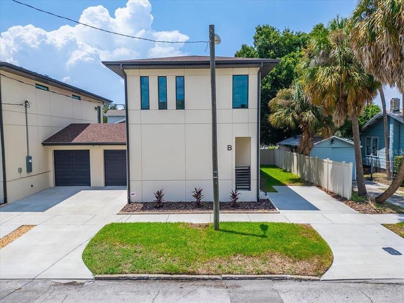 Front exterior of a new home in , Tampa, FL, highlighting curb appeal (Image 33).