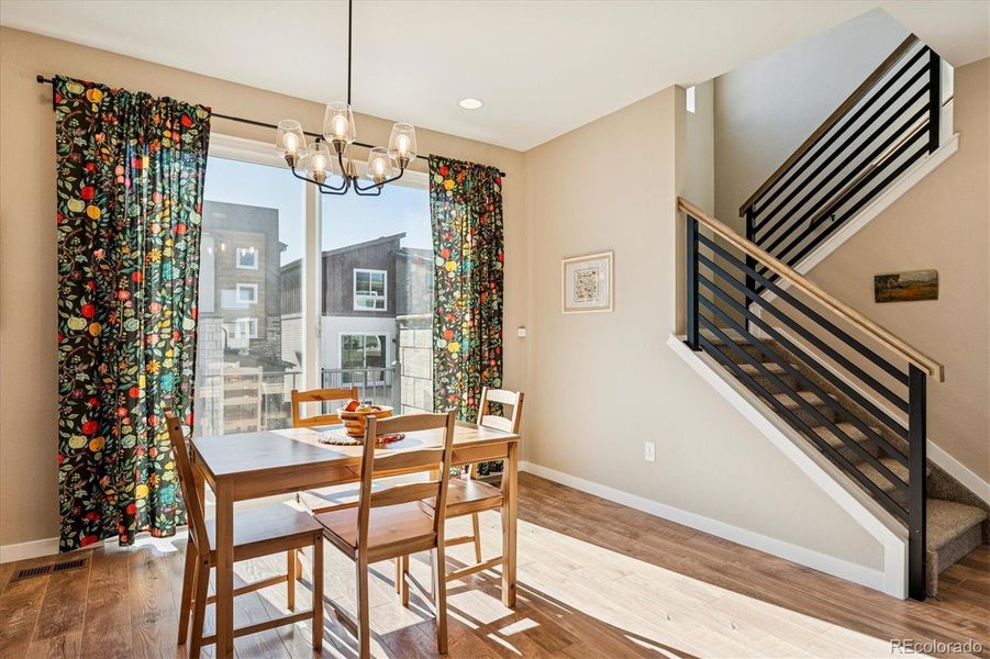 Spacious Dining Room with Laminate Flooring Spacious Dining Room with Laminate Flooring