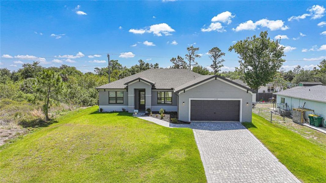 Front exterior of a new home in , Port Charlotte, FL, highlighting curb appeal (Image 33). Front exterior of a new home in , Port Charlotte, FL, highlighting curb appeal (Image 33).
