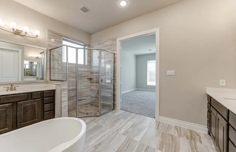 Representative furnished interior of a home built from the 3798 by Ravenna Homes in The Woodlands Hills 65′, Willis (Image 25).